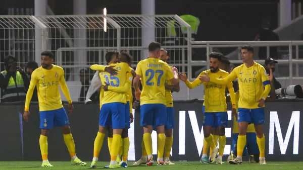Nassr's players celebrate their team's third goal during the Saudi Pro League football match between Al-Shabab and Al-Nassr at the Al-Shabab Club Stadium in Riyadh on February 25, 2024. (Photo by Fayez NURELDINE / AFP)
