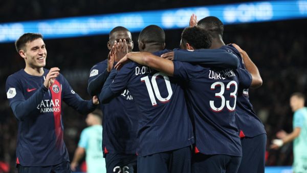 Paris Saint-Germain's French midfielder #33 Warren Zaire-Emery celebrates scoring his team's second goal with Paris Saint-Germain's French forward #10 Ousmane Dembele and teammates during the French L1 football match between Paris Saint-Germain (PSG) and Montpellier Herault SC at The Parc des Princes Stadium in Paris on November 3, 2023. (Photo by FRANCK FIFE / AFP)