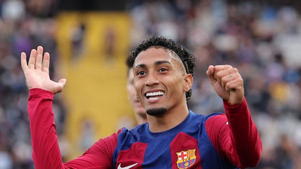 Barcelona's Brazilian forward #11 Raphinha celebrates scoring his team's first goal during the Spanish league football match between FC Barcelona and Getafe CF at the Estadi Olimpic Lluis Companys in Barcelona on February 24, 2024. (Photo by LLUIS GENE / AFP)