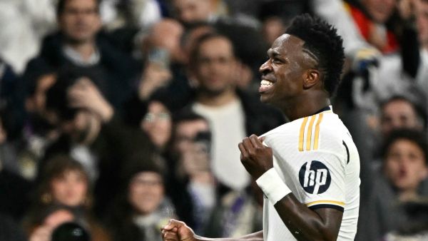Real Madrid's Brazilian forward #07 Vinicius Junior celebrates scoring the opening goal during the UEFA Champions League last 16 second leg football match between Real Madrid CF and RB Leipzig at the Santiago Bernabeu stadium in Madrid on March 6, 2024. (Photo by JAVIER SORIANO / AFP)