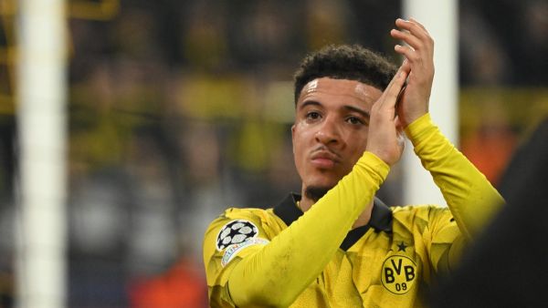 Dortmund's English midfielder #10 Jadon Sancho applauds the fans as he goes off injured during the UEFA Champions League last 16, second-leg football match BVB Borussia Dortmund v PSV Eindhoven at the Signal Iduna stadium in Dortmund, western Germany on March 13, 2024. (Photo by INA FASSBENDER / AFP)