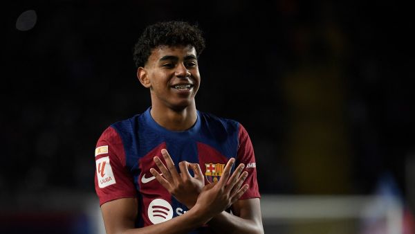 Barcelona's Spanish forward #27 Lamine Yamal celbrates scoring the opening goal during the Spanish league football match between FC Barcelona and Granada FC at the Estadi Olimpic Lluis Companys in Barcelona on February 11, 2024. (Photo by Josep LAGO / AFP)