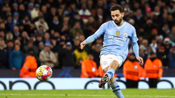 Manchester City's Portuguese midfielder #20 Bernardo Silva shoots the ball but misses to score during the penalty shootout during the UEFA Champions League quarter-final second-leg football match between Manchester City and Real Madrid, at the Etihad Stadium, in Manchester, north-west England, on April 17, 2024. (Photo by Darren Staples / AFP)