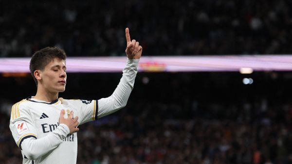Real Madrid's Turkish midfielder #24 Arda Guler celebrates scoring his team's fourth goal during the Spanish league football match between Real Madrid CF and RC Celta de Vigo at the Santiago Bernabeu stadium in Madrid on March 10, 2024. (Photo by Pierre-Philippe MARCOU / AFP)