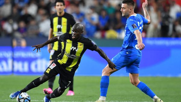 Ittihad's French midfielder #07 N'Golo Kante runs past Hilal's Serbian midfielder #22 Sergej Milinkovic-Savic during the Saudi Super Cup final football match between Al-Ittihad and Al-Hilal at the Mohammed bin Zayed Stadium in Abu Dhabi on April 11, 2024. (Photo by Ryan LIM / AFP)