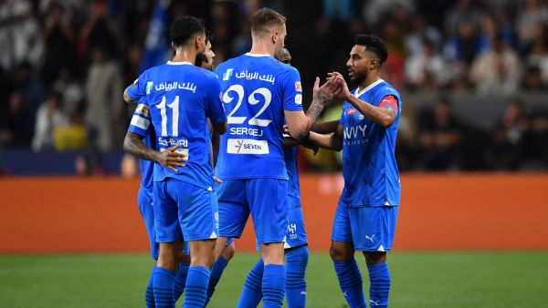 Hilal's Saudi midfielder #29 Salem al-Dawsari celebrates with teammates after scoring his team's second goal during the Saudi Super Cup final football match between Al-Ittihad and Al-Hilal at the Mohammed bin Zayed Stadium in Abu Dhabi on April 11, 2024. (Photo by Ryan LIM / AFP)