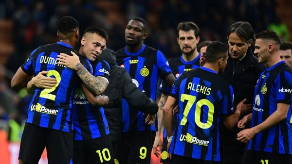 Inter Milan's players celebrate their 2-0 victory at the end of the Italian Serie A football match between Inter Milan and Empoli in Milan, on April 1, 2024. (Photo by Piero CRUCIATTI / AFP)
