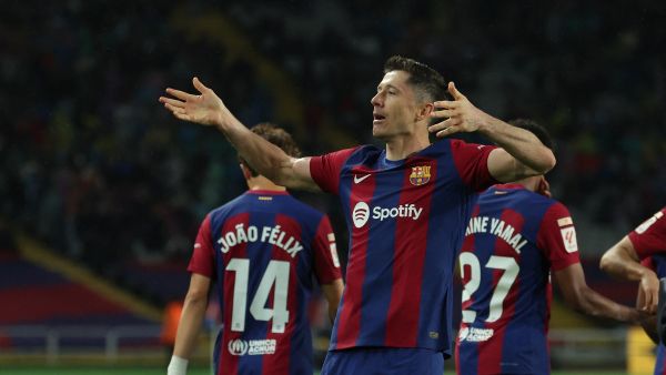 Barcelona's Polish forward #09 Robert Lewandowski celebrates after scoring his team's third goal during the Spanish league football match between FC Barcelona and Valencia CF at the Estadi Olimpic Lluis Companys in Barcelona on April 29, 2024. (Photo by LLUIS GENE / AFP)