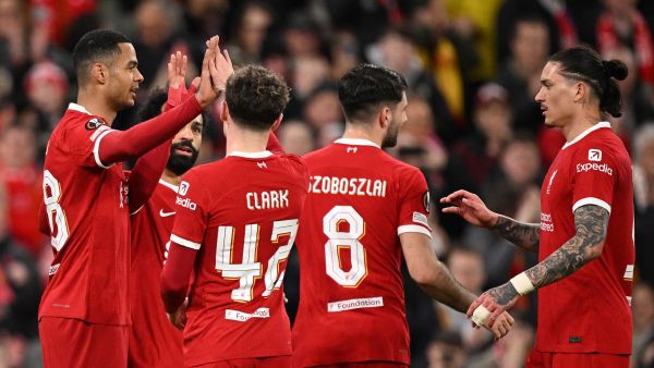 Liverpool's Dutch striker #18 Cody Gakpo (L) celebrates scoring the team's fourth goal with Liverpool's Egyptian striker #11 Mohamed Salah, Liverpool's English midfielder #42 Bobby Clark and Liverpool's Uruguayan striker #09 Darwin Nunez during the UEFA Europa League round of 16 second leg football match between Liverpool and AC Sparta Praha at Anfield in Liverpool, north west England on March 14, 2024. (Photo by Oli SCARFF / AFP)