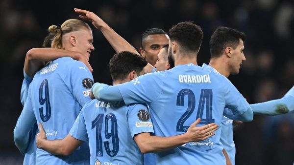 Manchester City's Norwegian striker #09 Erling Haaland (L) celebrates with teammates after scoring their third goal during the UEFA Champions League round of 16, second-leg, football match between Manchester City and FC Copenhagen at the Etihad Stadium, in Manchester, north west England, on March 6, 2024. (Photo by Paul ELLIS / AFP)