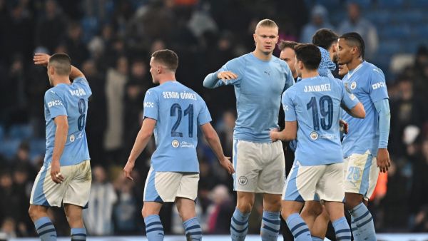 Manchester City's players celebrate on the pitch after the UEFA Champions League round of 16, second-leg, football match between Manchester City and FC Copenhagen at the Etihad Stadium, in Manchester, north west England, on March 6, 2024. City won the game 3-1, 6-2 on aggregate. (Photo by Paul ELLIS / AFP)