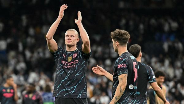 Manchester City's Norwegian striker #09 Erling Haaland applauds at the end of the UEFA Champions League quarter final first leg football match between Real Madrid CF and Manchester City at the Santiago Bernabeu stadium in Madrid on April 9, 2024. The match ended in a 3-3 draw. (Photo by JAVIER SORIANO / AFP)