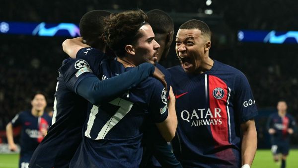Paris Saint-Germain's French forward #07 Kylian Mbappe (R) celebrates after Paris Saint-Germain's French forward #10 Ousmane Dembele (C) scored an equalizer during the UEFA Champions League quarter final first leg football match between Paris Saint-Germain (PSG) and FC Barcelona at the Parc des Princes stadium in Paris on April 10, 2024. (Photo by MIGUEL MEDINA / AFP)