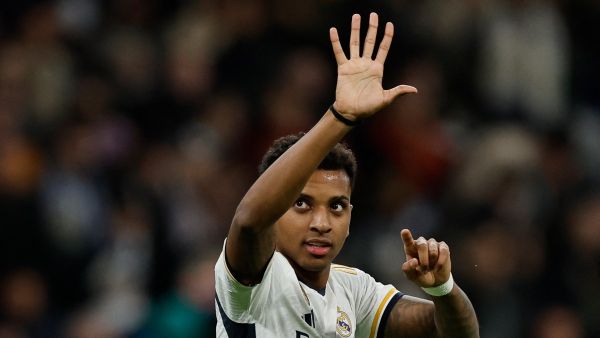 Real Madrid's Brazilian forward #11 Rodrygo celebrates after scoring his team's second goal during the Spanish league football match between Real Madrid CF and Granada FC at the Santiago Bernabeu stadium in Madrid on December 1, 2023. (Photo by OSCAR DEL POZO / AFP)