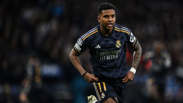 Real Madrid's Brazilian forward #11 Rodrygo celebrates after scoring his team first goal during the UEFA Champions League quarter-final second-leg football match between Manchester City and Real Madrid, at the Etihad Stadium, in Manchester, north-west England, on April 17, 2024. (Photo by Paul ELLIS / AFP)