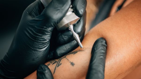 unlicensed tattoo artist