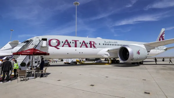 A Qatar Airways Boeing 787-9 jetliner aircraft is pictured on the tarmac (Photo by Giuseppe CACACE / AFP)