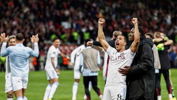 Aston Villa's Belgian midfielder #08 Youri Tielemans (2nd-R) celebrates his team's victory after the penalty shoot out at the end of the UEFA Europa Conference League quarter-final second leg football match between Lille and Aston Villa at Stade Pierre-Mauroy in Villeneuve-d'Ascq, northern France on April 18, 2024. Aston Villa won over Lille 4-3 after the penalty shoot-outs and Villa qualified for the semi-finals. (Photo by Sameer Al-DOUMY / AFP)