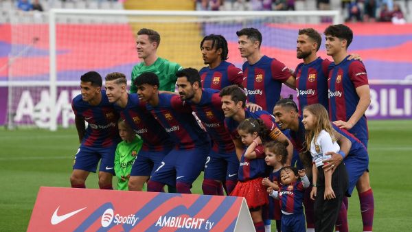 Barcelona's players pose for a team picture before the start of the Spanish League football match between FC Barcelona and Rayo Vallecano de Madrid at the Estadi Olimpic Lluis Companys in Barcelona on May 19, 2024. (Photo by MANAURE QUINTERO / AFP)