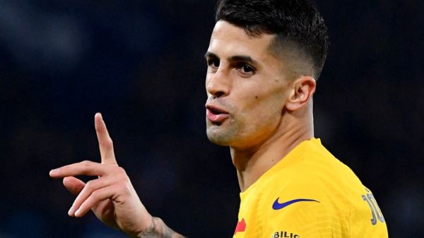 Barcelona's Portuguese defender #02 Joao Cancelo gestures during the UEFA Champions League round of 16 first Leg football match between Napoli and Barcelona at the Diego-Armando-Maradona stadium in Naples on February 21, 2024. (Photo by Tiziana FABI / AFP)