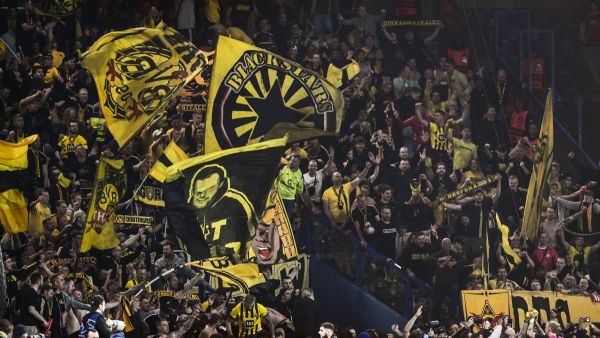Dortmund fans celebrate their victory at the end of their UEFA Champions League semi-final second leg football match against Paris Saint-Germain (PSG) at the Parc des Princes stadium in Paris on May 7, 2024. (Photo by MIGUEL MEDINA / AFP)