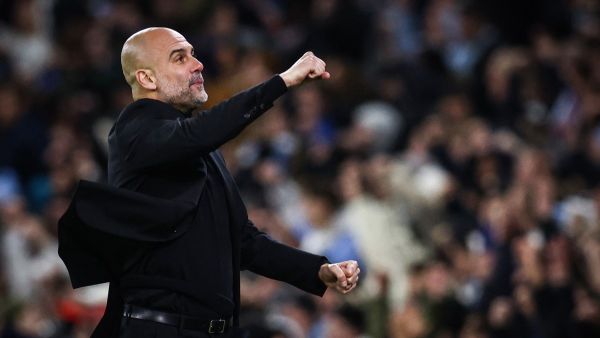 Manchester City's Spanish manager Pep Guardiola celebrates following his team first goal scored by Manchester City's Belgian midfielder #17 Kevin De Bruyne during the UEFA Champions League quarter-final second-leg football match between Manchester City and Real Madrid, at the Etihad Stadium, in Manchester, north-west England, on April 17, 2024. (Photo by Darren Staples / AFP)