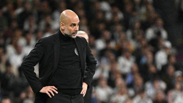 Manchester City's Spanish manager Pep Guardiola watches his players from the touchline during the UEFA Champions League quarter final first leg football match between Real Madrid CF and Manchester City at the Santiago Bernabeu stadium in Madrid on April 9, 2024. (Photo by JAVIER SORIANO / AFP)