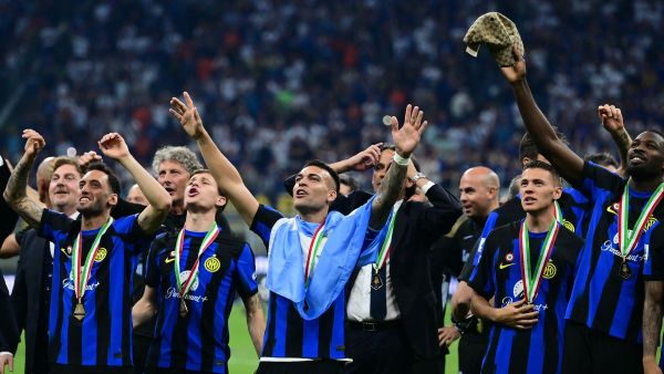 Inter Milan's Argentine forward #10 Lautaro Martinez (C) celebrates with teammates during the trophy ceremony for the Italian Champions following the Italian Serie A football match between Inter Milan and Lazio in Milan, on May 19, 2024. Inter celebrates his 20th Scudetto. (Photo by Marco BERTORELLO / AFP)