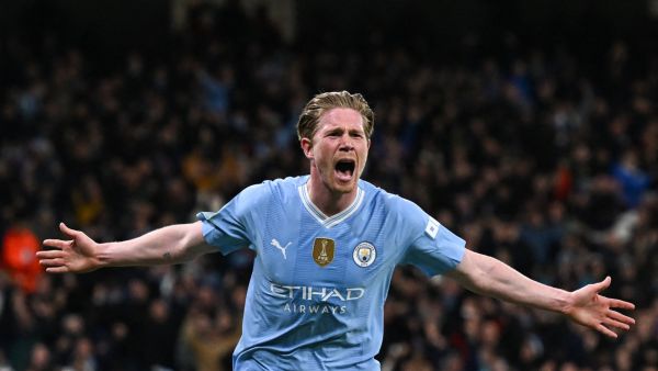 Manchester City's Belgian midfielder #17 Kevin De Bruyne celebrates after scoring his team first and equalising goal during the UEFA Champions League quarter-final second-leg football match between Manchester City and Real Madrid, at the Etihad Stadium, in Manchester, north-west England, on April 17, 2024. (Photo by Paul ELLIS / AFP)