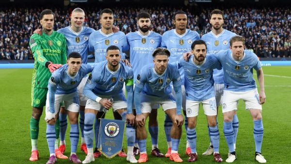 Man City players pose for team photo during the UEFA Champions League quarter-final second-leg football match between Manchester City and Real Madrid, at the Etihad Stadium, in Manchester, north-west England, on April 17, 2024. (Photo by Darren Staples / AFP)