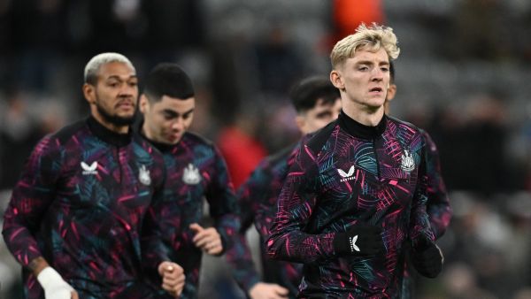 Newcastle United's English midfielder #10 Anthony Gordon warms up prior to the UEFA Champions League Group F football match between Newcastle United and AC Milan at St James' Park in Newcastle-upon-Tyne, north east England on December 13, 2023. (Photo by Paul ELLIS / AFP)