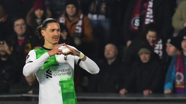 Liverpool's Uruguayan striker #09 Darwin Nunez celebrates after scoring a goal with team mates and fans during the UEFA Europa League round of 16 first leg football match between AC Sparta Praha and Liverpool FC in Prague on March 7, 2024. (Photo by MICHAL CIZEK / AFP)