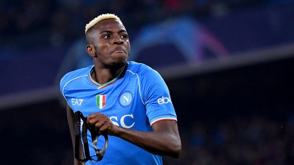Napoli's Nigerian forward #09 Victor Osimhen celebrates after scoring a goal during the UEFA Champions League round of 16 first Leg football match between Napoli and Barcelona at the Diego-Armando-Maradona stadium in Naples on February 21, 2024. (Photo by Tiziana FABI / AFP)