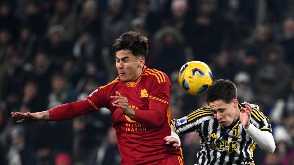 Juventus Turkish forward #15 Kenan Yildiz (R) and Roma's Argentine forward #21 Paulo Dybala (L) fight for the ball during the Italian Serie A football match between Juventus and Roma at the Allianz Stadium in Turin, on December 30, 2023. (Photo by Isabella BONOTTO / AFP)