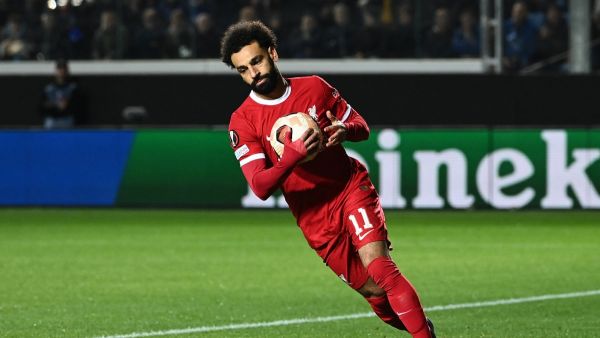 Liverpool's Egyptian forward #11 Mohamed Salah celebrates after scoring a penalty during the UEFA Europa League quarter-final second leg football match between Atalanta BC and Liverpool FC at the Atleti Azzurri d'Italia Stadium in Bergamo, on April 18, 2024. (Photo by Isabella BONOTTO / AFP)