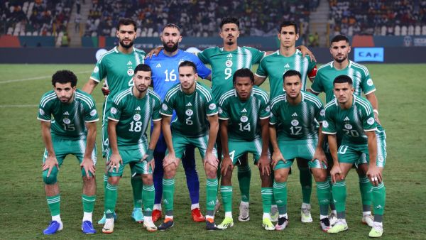 Algeria's team pose for a team photo ahead of the Africa Cup of Nations (CAN) 2024 group D football match between Mauritania and Algeria at Stade de la Paix in Bouake on January 23, 2024. (Photo by Kenzo TRIBOUILLARD / AFP)