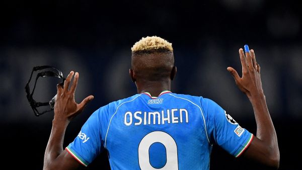 Napoli's Nigerian forward #09 Victor Osimhen celebrates after scoring a goal during the UEFA Champions League round of 16 first Leg football match between Napoli and Barcelona at the Diego-Armando-Maradona stadium in Naples on February 21, 2024. (Photo by Tiziana FABI / AFP)