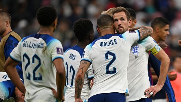 England's defender #02 Kyle Walker and England's forward #09 Harry Kane react at the end of the Qatar 2022 World Cup quarter-final football match between England and France at the Al-Bayt Stadium in Al Khor, north of Doha, on December 10, 2022. (Photo by Paul ELLIS / AFP)