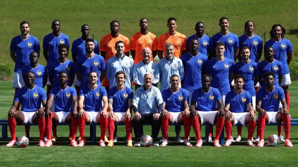 France's head coach Didier Deschamps (Bottom Centre), French forward and captain Kylian Mbappe (Bottom CR) and France's players and coaching staff pose for a photo ahead of a training session as part of the team's preparation for the UEFA Euro 2024 European football championships, in Clairefontaine-en-Yvelines, on June 7, 2024. (Photo by FRANCK FIFE / AFP)