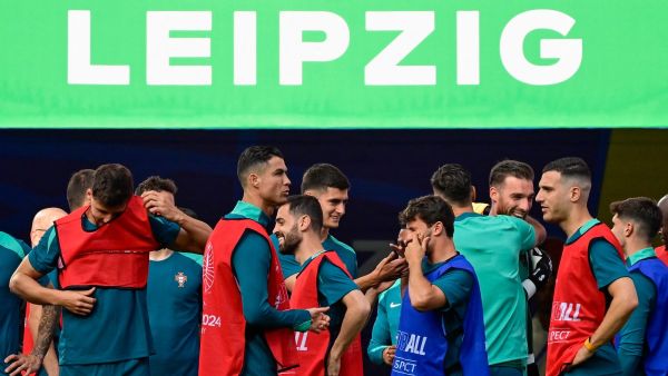 Portugal's players including Portugal's forward #07 Cristiano Ronaldo (C) arrive for the MD-1 training session at the Leipzig Stadium in Leipzig, eastern Germany on June 17, 2024, on the eve of their UEFA Euro 2024 Group F football match against the Czech Republic. (Photo by JOHN MACDOUGALL / AFP)