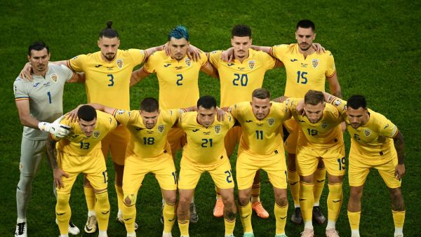Romania's players pose prior to the UEFA Euro 2024 Group E football match between Belgium and Romania at the Cologne Stadium in Cologne on June 22, 2024. (Photo by Angelos Tzortzinis / AFP)