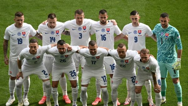 Slovakia's players pose for a team picture during the UEFA Euro 2024 Group E football match between Belgium and Slovakia at the Frankfurt Arena in Frankfurt am Main on June 17, 2024. (Photo by Angelos Tzortzinis / AFP)