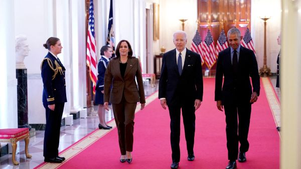 US Vice President Kamala Harris, US President Joe Biden, and former President Barack Obama arrive to deliver remarks on the Affordable Care Act and Medicaid in the East Room of the White House in Washington, DC, on April 5, 2022. (Photo by MANDEL NGAN / AFP) Harris, Biden and Obama