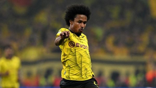 Dortmund's German forward #27 Karim Adeyemi runs with the ball during the UEFA Champions League final football match between Borussia Dortmund and Real Madrid, at Wembley stadium, in London, on June 1, 2024. (Photo by Glyn KIRK / AFP)