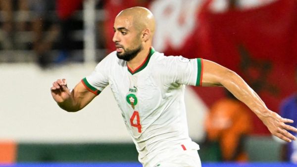 Morocco's midfielder #4 Sofyan Amrabat runs with the ball during the Africa Cup of Nations (CAN) 2024 group F football match between Zambia and Morocco at the Stade Laurent Pokou in San Pedro on January 24, 2024. (Photo by SIA KAMBOU / AFP)