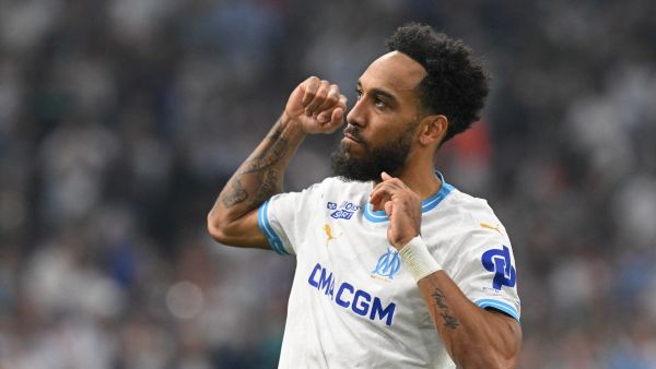Marseille's French-Gabonese forward #10 Pierre-Emerick Aubameyang celebrates scoring his team's third goal during the French L1 football match between Olympique Marseille (OM) and FC Lorient at the Stade Velodrome in Marseille, southern France, on May 12, 2024. (Photo by Nicolas TUCAT / AFP)