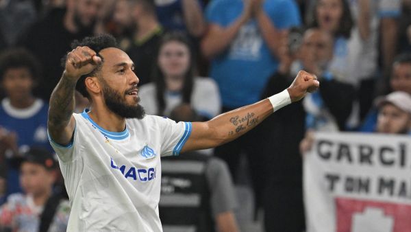 Marseille's French-Gabonese forward #10 Pierre-Emerick Aubameyang celebrates after scoring his team's first goal during the French L1 football match between Olympique Marseille (OM) and FC Lorient at the Stade Velodrome in Marseille, southern France, on May 12, 2024. (Photo by Nicolas TUCAT / AFP)
