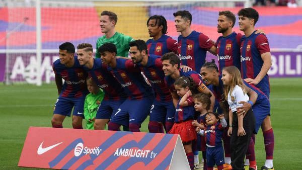 Barcelona's players pose for a team picture before the start of the Spanish League football match between FC Barcelona and Rayo Vallecano de Madrid at the Estadi Olimpic Lluis Companys in Barcelona on May 19, 2024. (Photo by MANAURE QUINTERO / AFP)