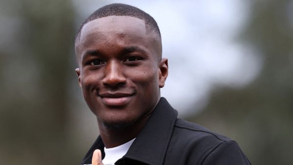 Fance's forward Moussa Diaby gestures as he arrives to take part in the French team's preparation for upcoming friendly football matches in Clairefontaine-en-Yvelines on March 18, 2024. (Photo by FRANCK FIFE / AFP)