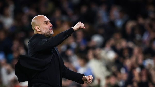 Manchester City's Spanish manager Pep Guardiola celebrates following his team first goal scored by Manchester City's Belgian midfielder #17 Kevin De Bruyne during the UEFA Champions League quarter-final second-leg football match between Manchester City and Real Madrid, at the Etihad Stadium, in Manchester, north-west England, on April 17, 2024. (Photo by Darren Staples / AFP)